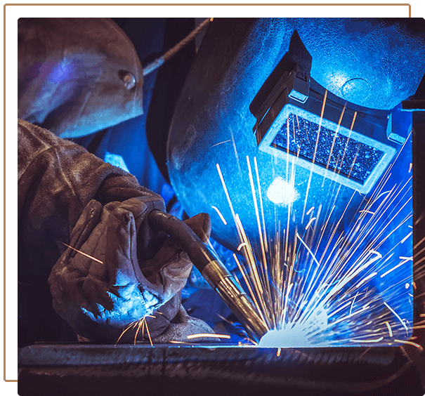 Industrial Worker labourer at the factory welding steel structure